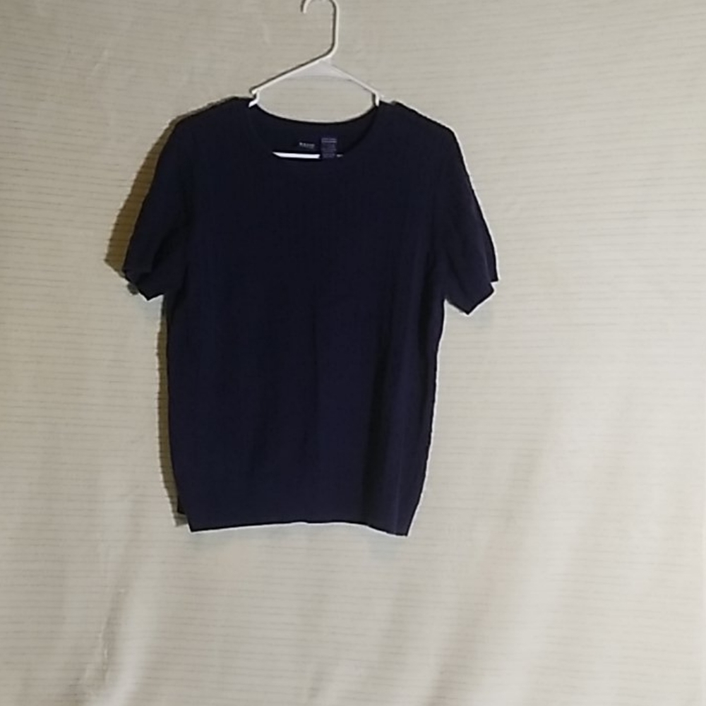 Sweater with braided design.